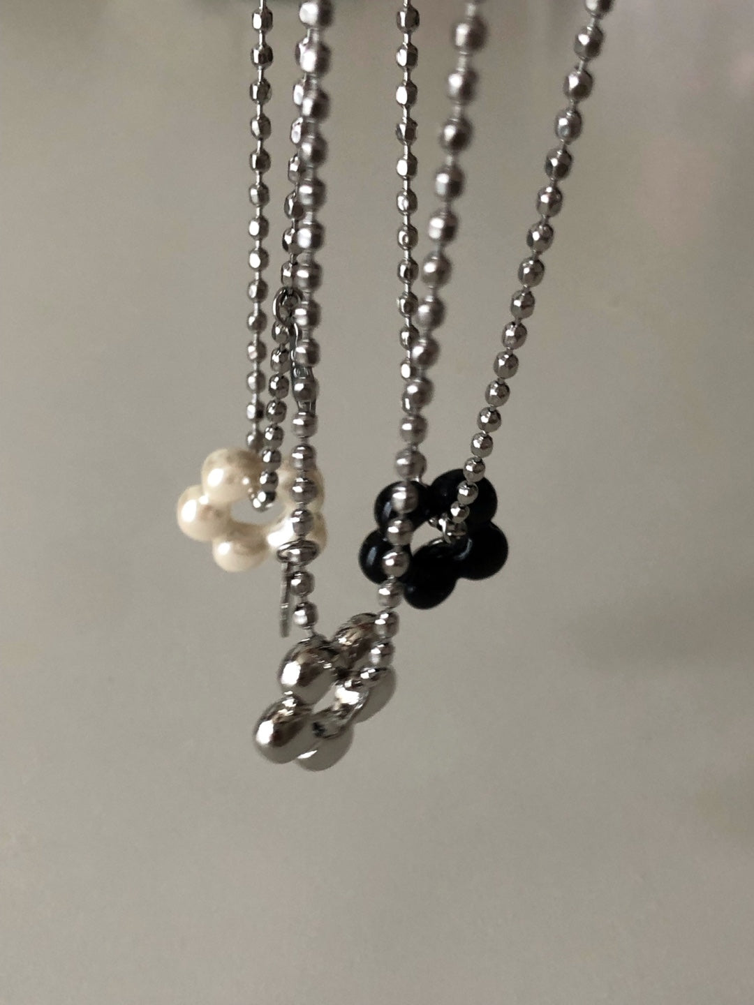 military emblem flower necklace
