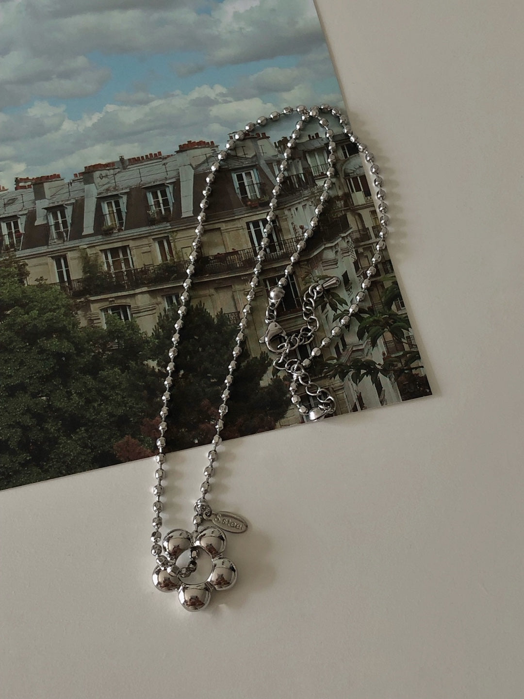 military emblem flower necklace