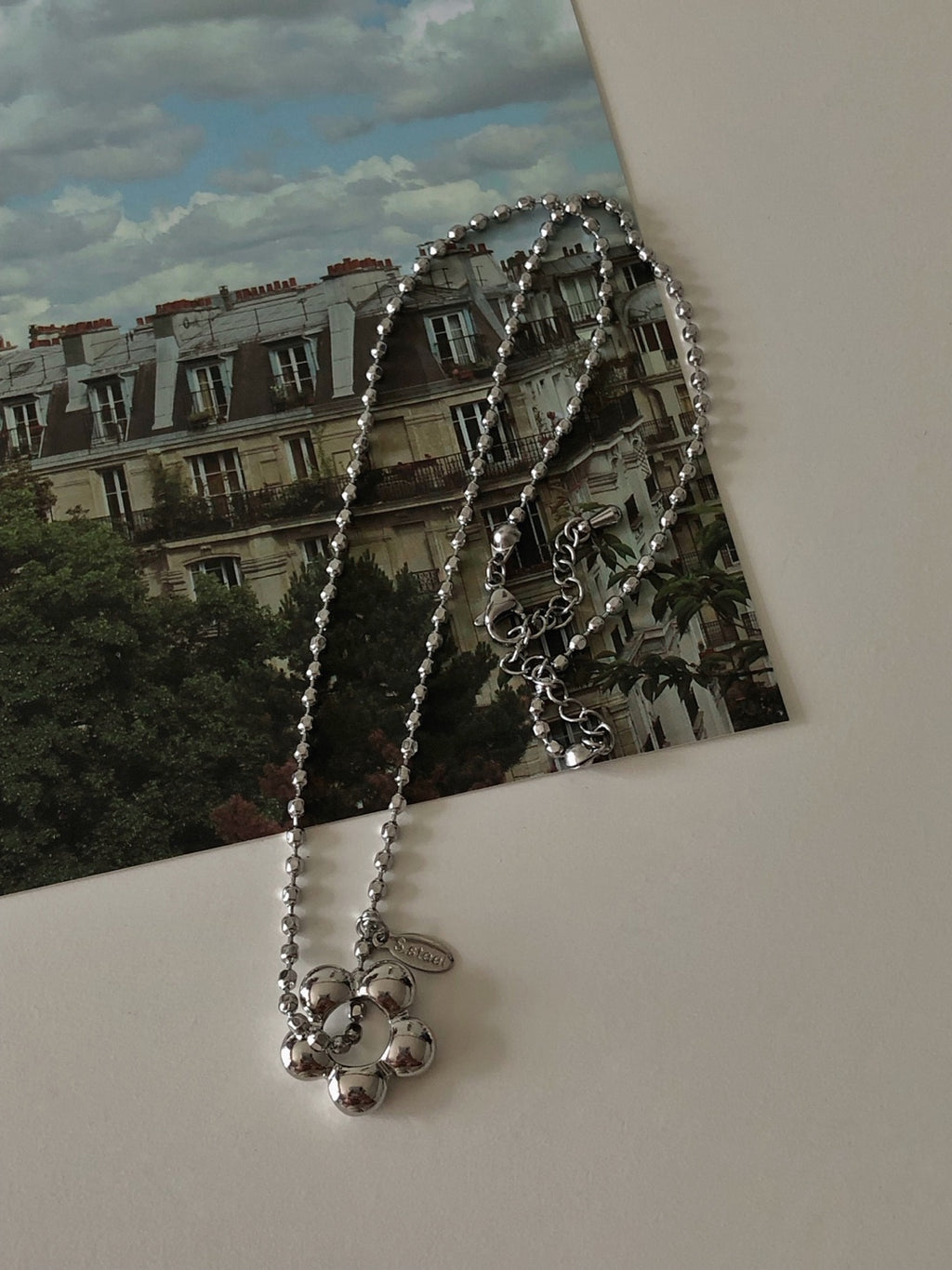 military emblem flower necklace