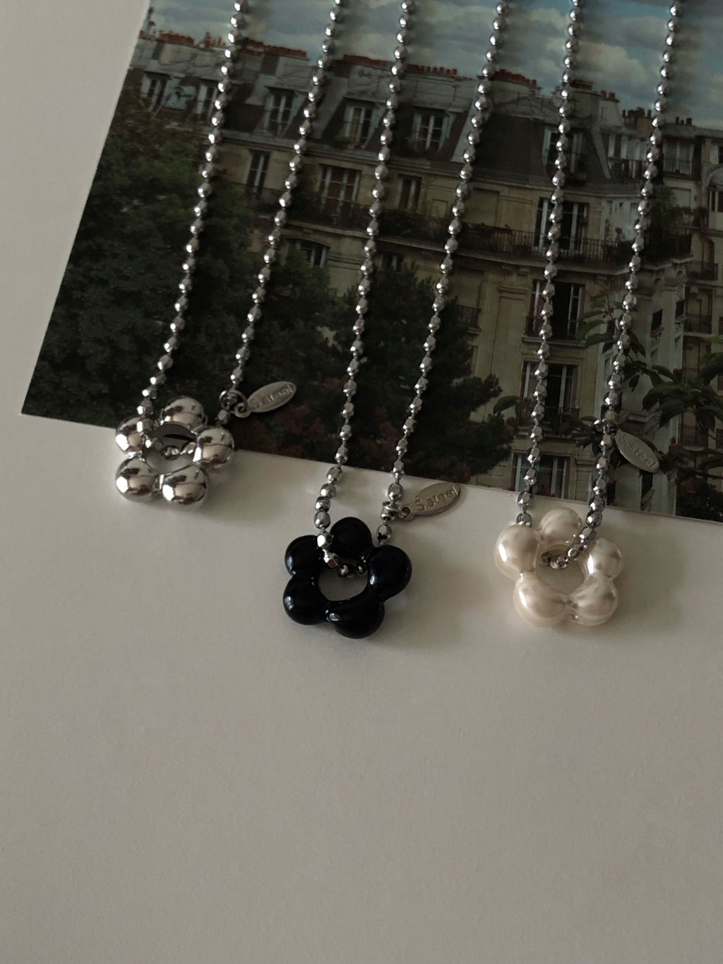 military emblem flower necklace