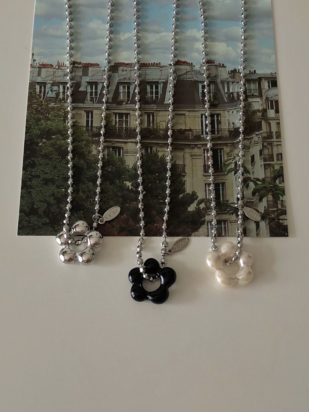 military emblem flower necklace