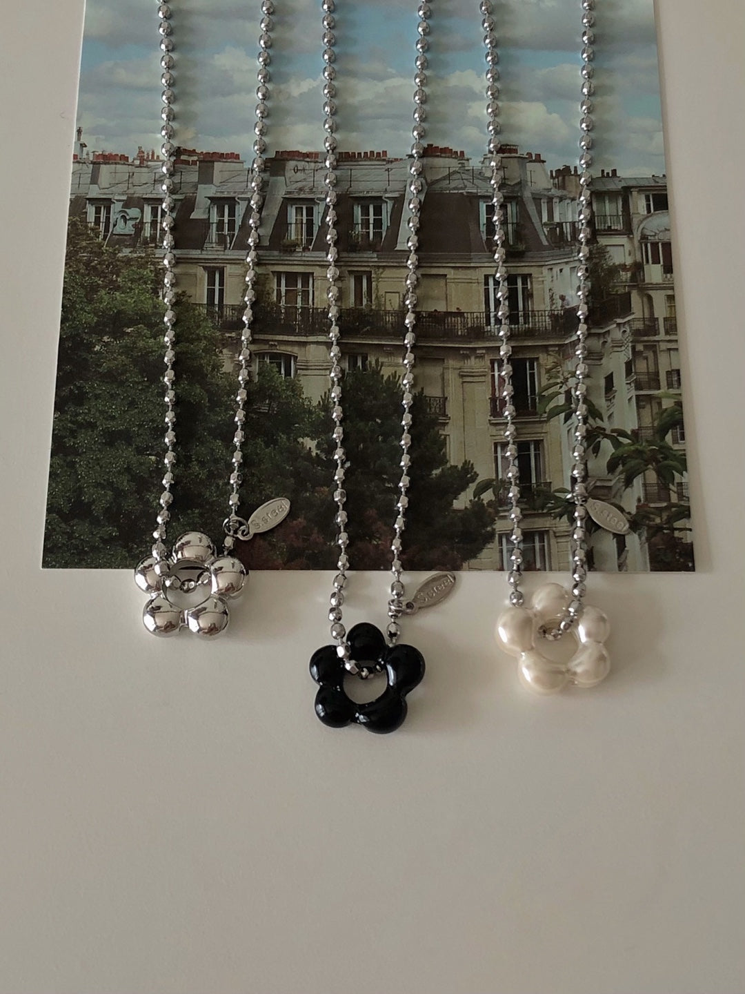 military emblem flower necklace