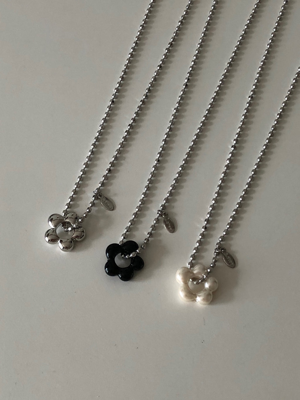 military emblem flower necklace