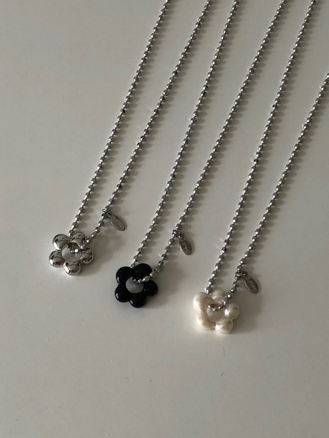 military emblem flower necklace
