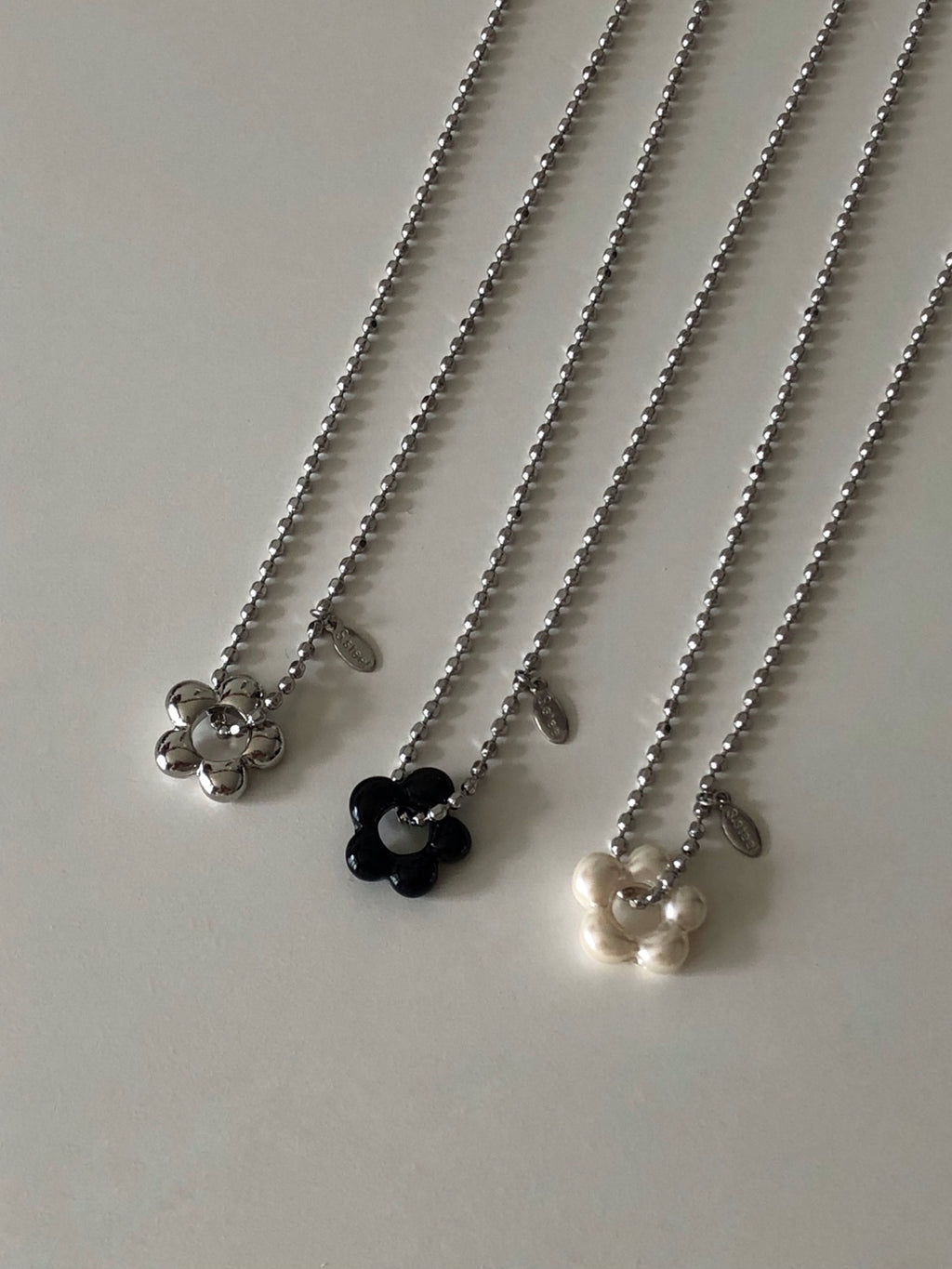 military emblem flower necklace