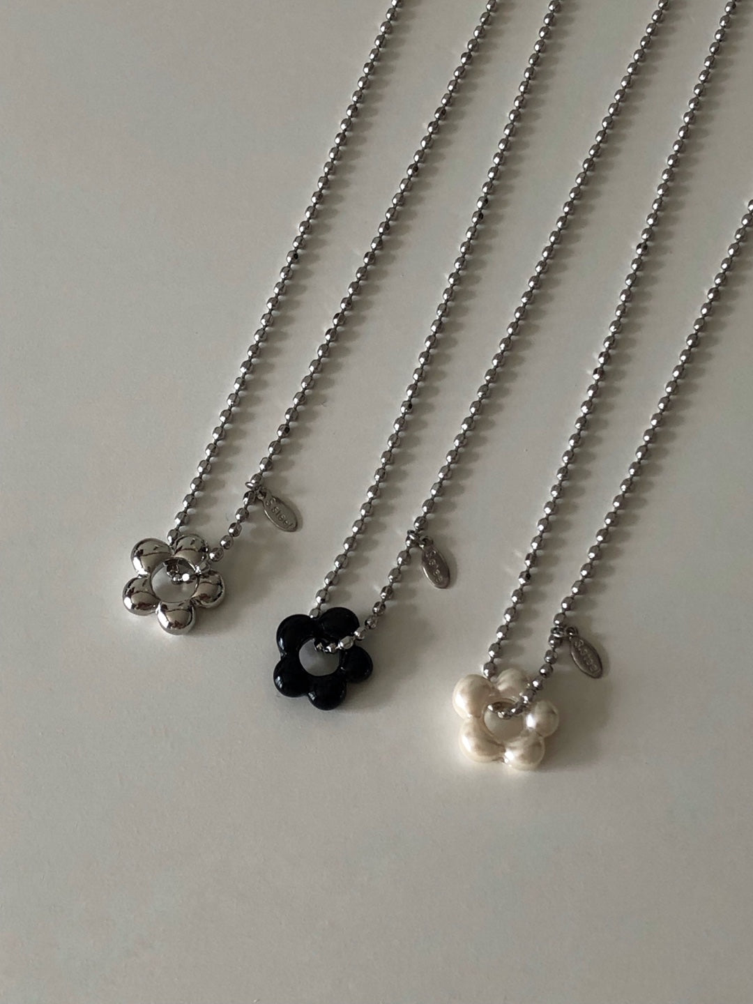 military emblem flower necklace