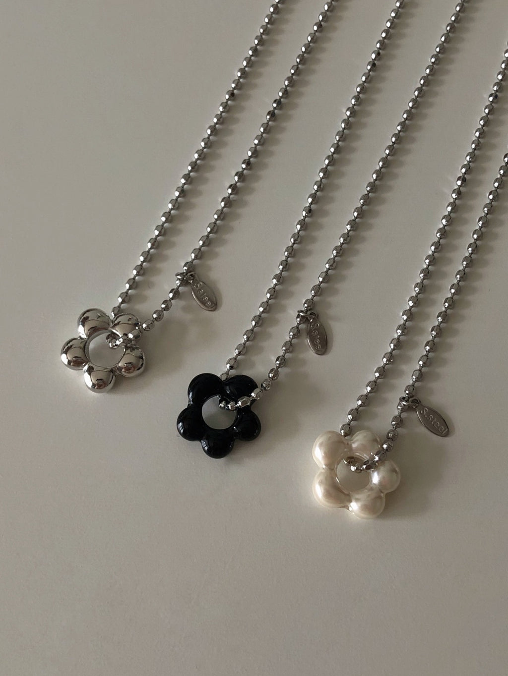 military emblem flower necklace