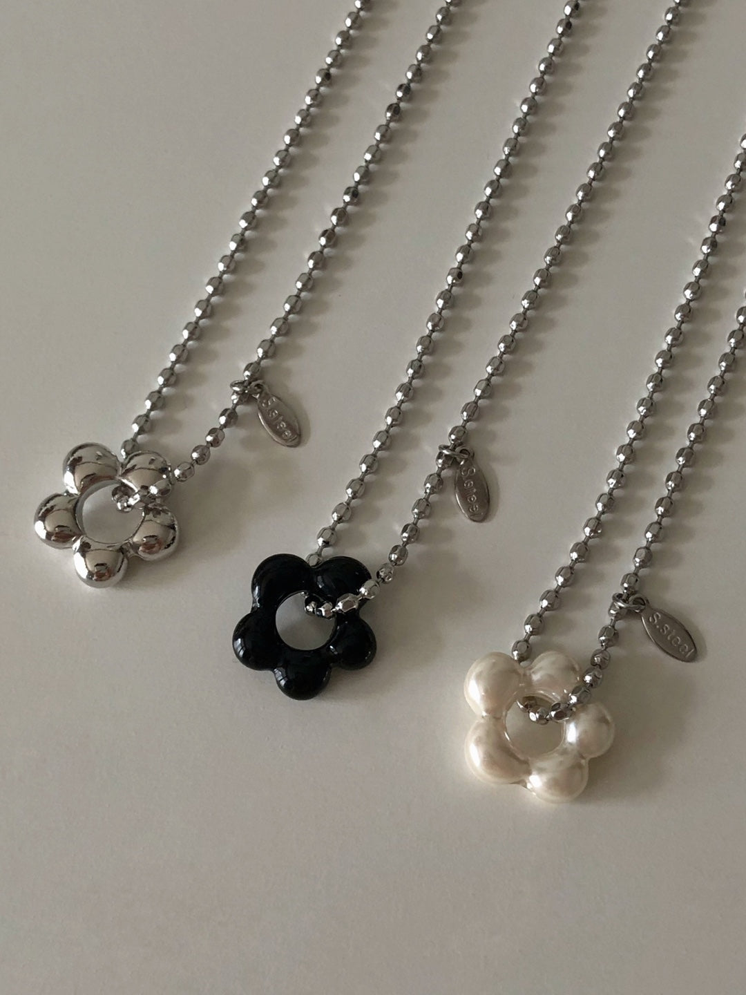 military emblem flower necklace