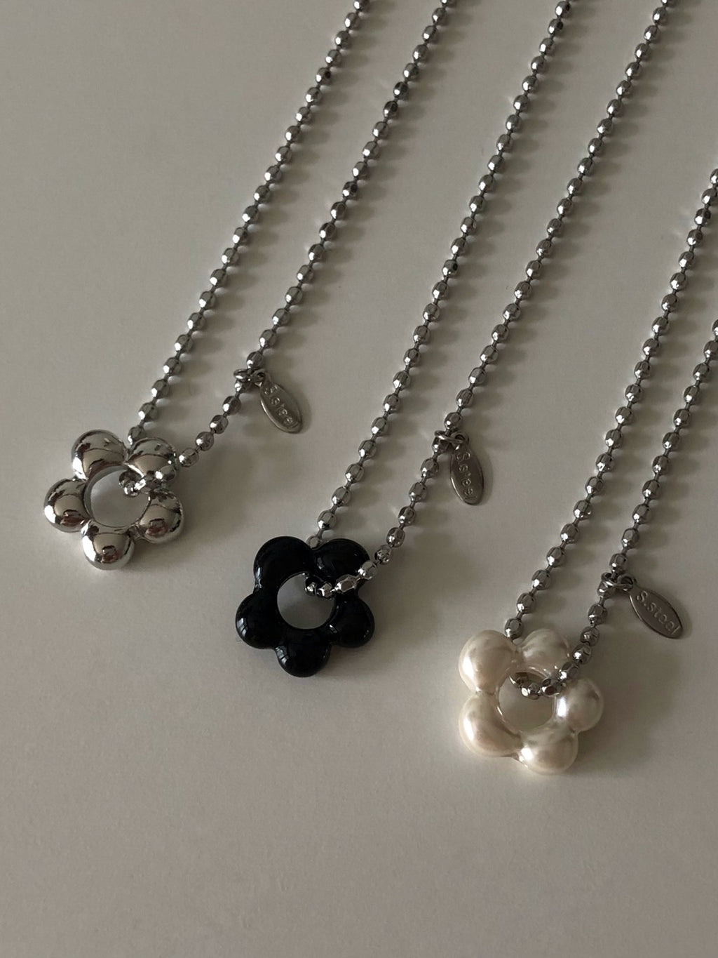 military emblem flower necklace