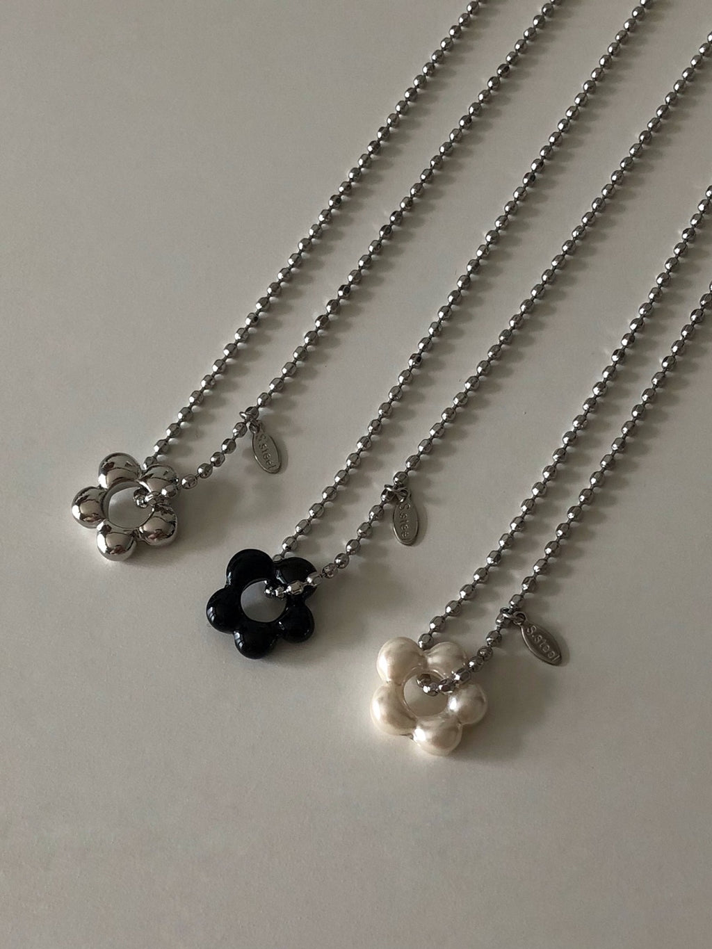 military emblem flower necklace