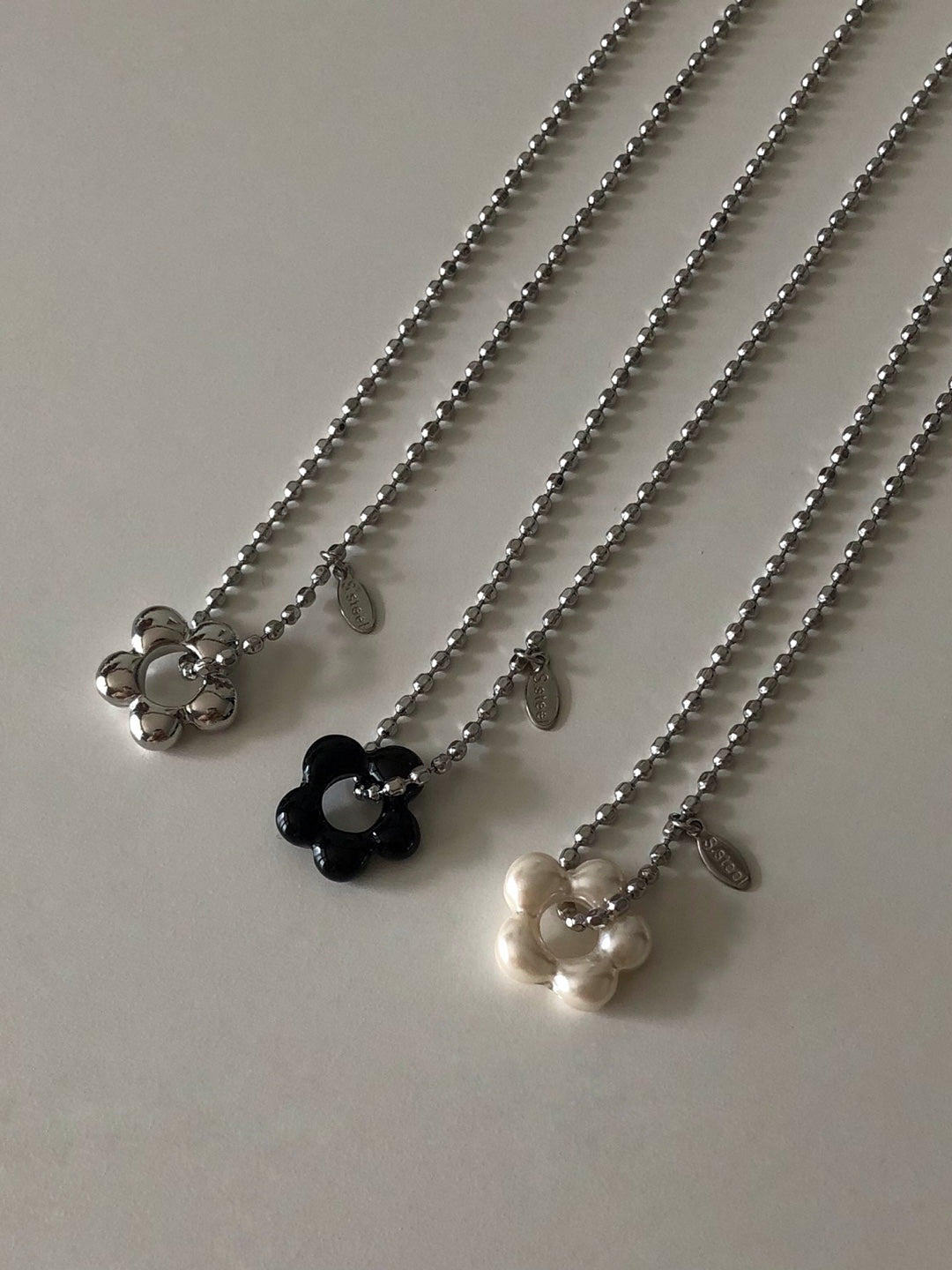 military emblem flower necklace