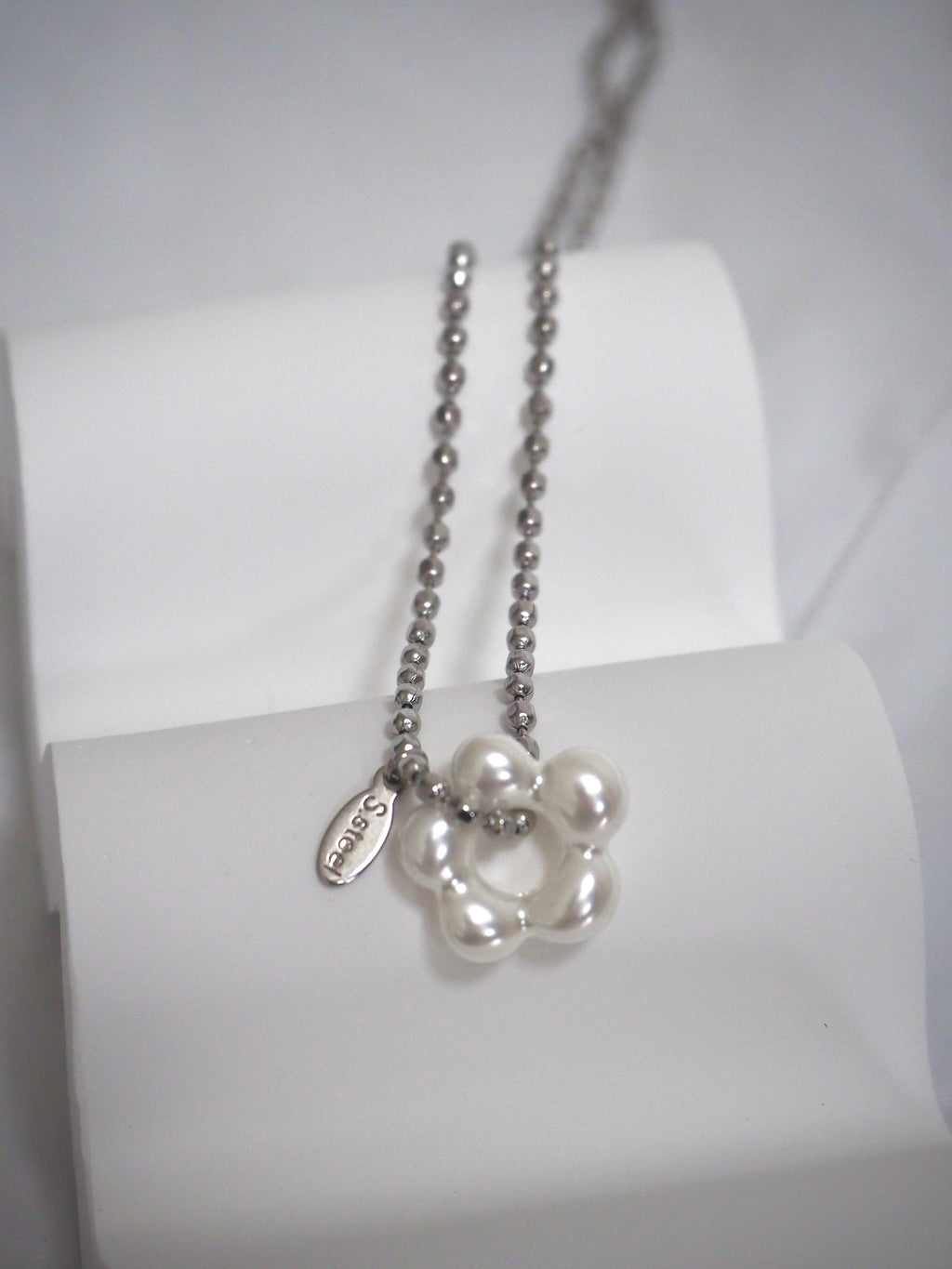 military emblem flower necklace