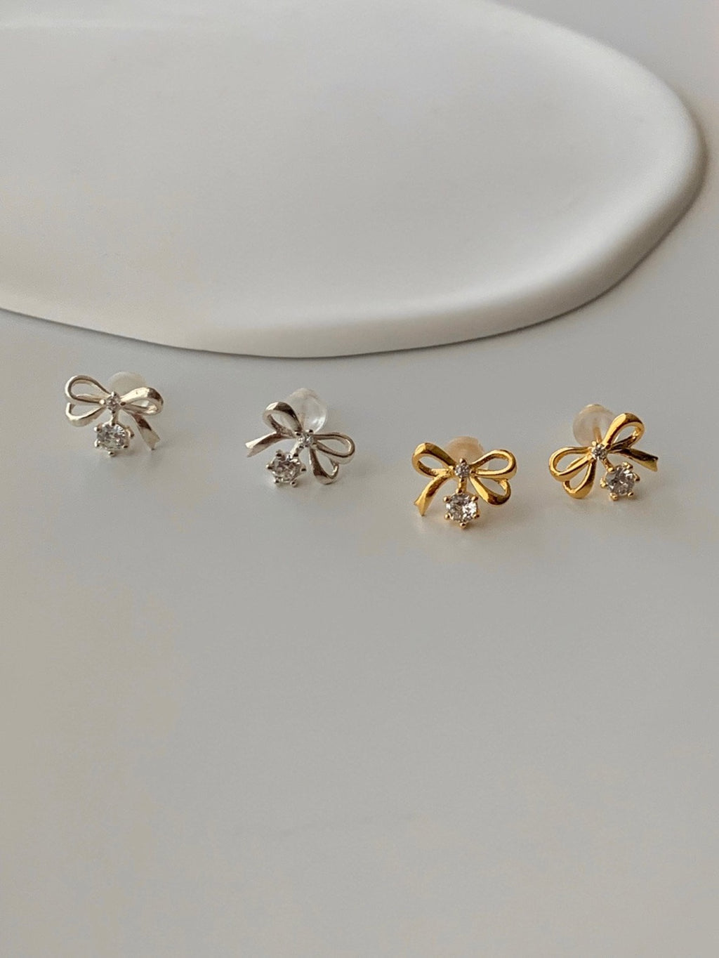 [925silver] ribbon cubic zirconia earrings